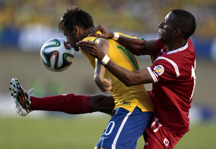 Neymar (left) of Brazil challenges Armando Cooper of Panama during an international friendly  match ahead of the 2014 World Cup, in Goiania June 3, 2014. u00e2u20acu201d Reuters pic