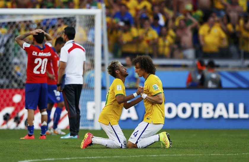 Brazil's David Luiz (right) and Neymar celebrate their win against Chile after their penalty shootout in their 2014 World Cup round of 16 game at the Mineirao stadium in Belo Horizonte June 29, 2014.u00c2u00a0u00e2u20acu201du00c2u00a0Reuters pic