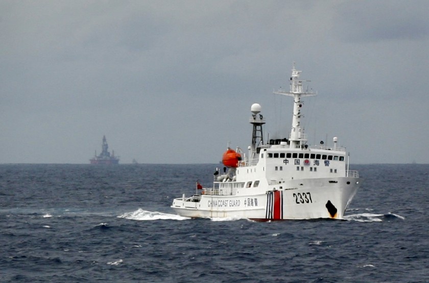 File picture shows a Chinese Coast Guard vessel (right) passing near the Chinese oil rig, Haiyang Shi You 981 (left) in the South China Sea, June 13, 2014. The Philippines said Chinau00e2u20acu2122s u00e2u20acu02dcexpansion agendau00e2u20acu2122 in the disputed South China Sea threatened se