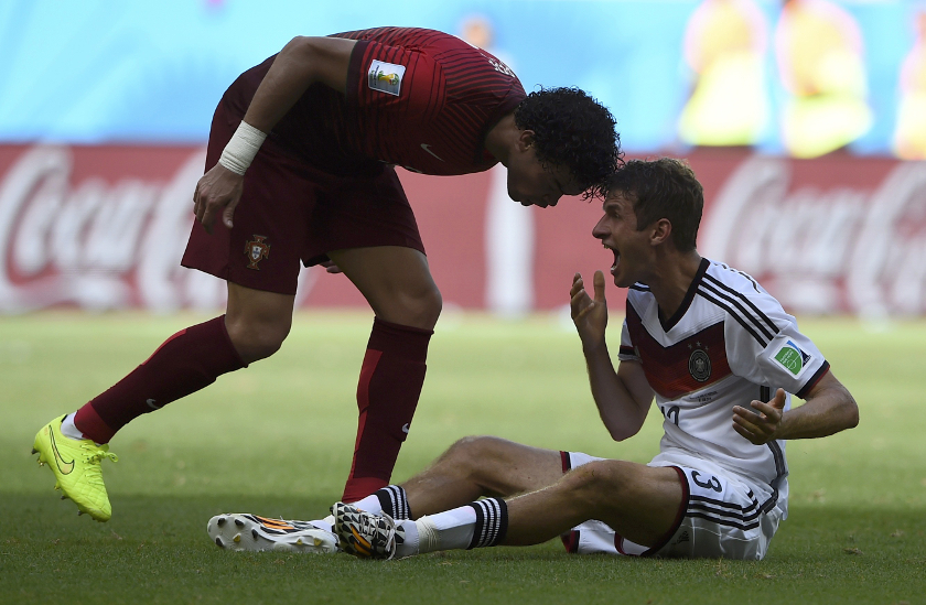 Portugal's Pepe headbutts Germany's Thomas Mueller (left), receiving him a red card, during their 2014 World Cup Group G match at the Fonte Nova arena in Salvador, June 16, 2014. u00e2u20acu201d Reuters pic