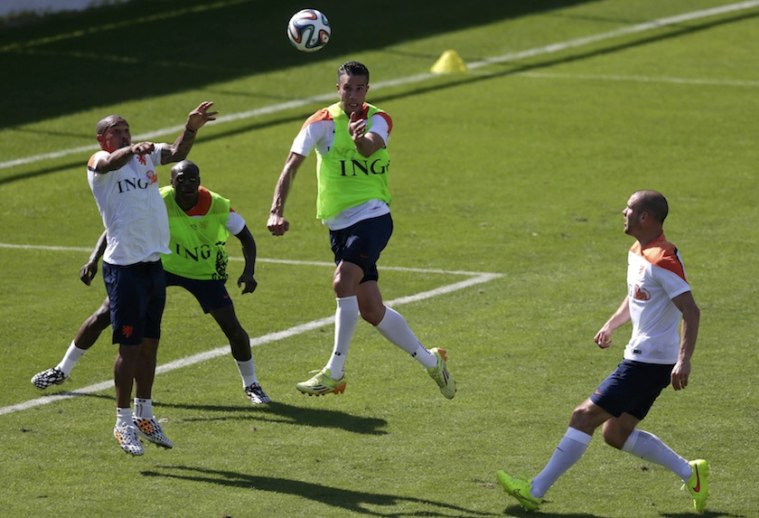Netherlands' national team player Robin Van Persie (centre) jumps for the ball during a training session ahead of the 2014 World Cup in Rio de Janeiro June 8, 2014.u00c2u00a0u00e2u20acu201d Reuters pic
