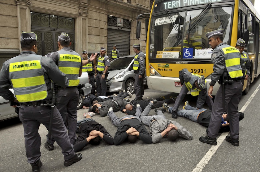 Police arrest men they believe attacked English fans before boarding a bus to escape, in Sao Paulo June 20, 2014. u00e2u20acu201du00c2u00a0Reuters pic