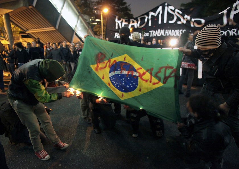 Demonstrators burn a Brazilian flag during a protest against the 2014 World Cup in Sao Paulo, June 20, 2014. u00e2u20acu201d Reuters pic