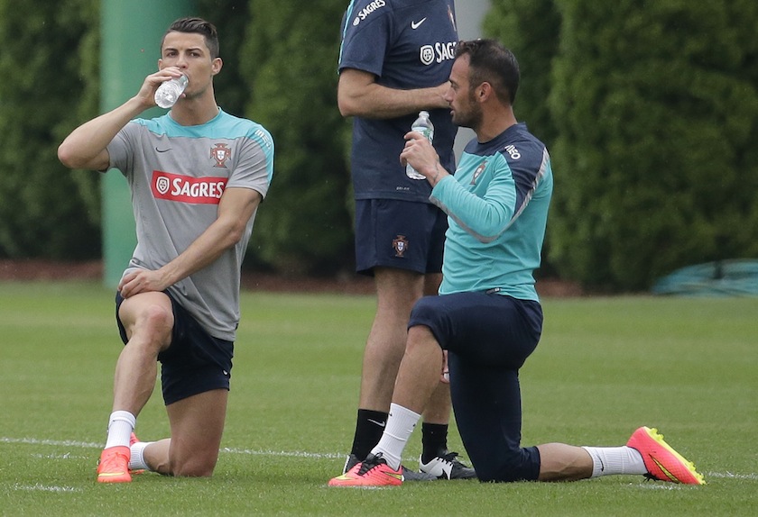 Cristiano Ronaldo (left) of Portugal's National Team rest after running laps with teammate Hugo Almeida as they practice for their upcoming friendly matches in Florham Park, New Jersey, June 3, 2014. u00e2u20acu201d Reuters pic