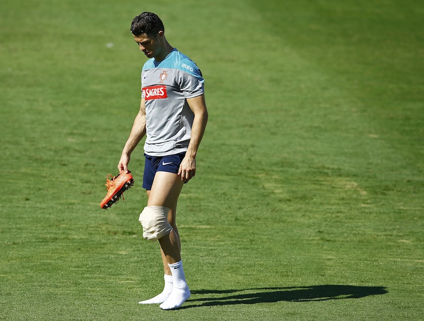 Portugal's Cristiano Ronaldo walks with his boots off during an open training session in Campinas, June 18, 2014. u00e2u20acu201d Reuters pic