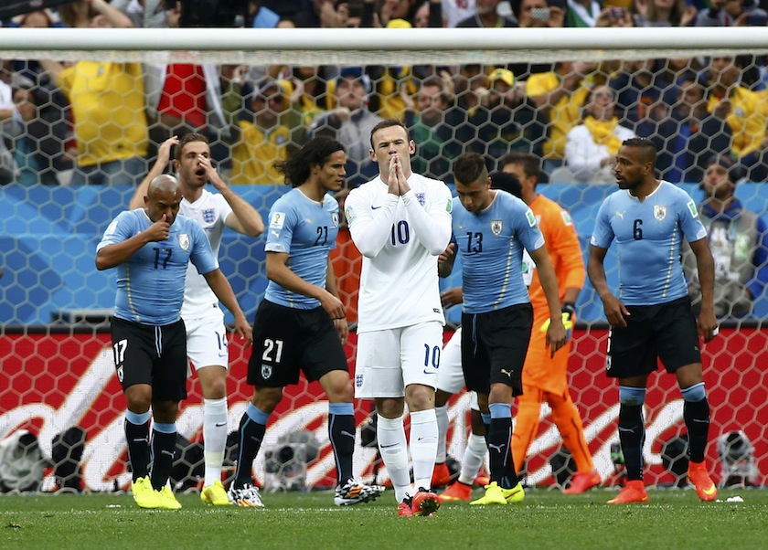 England's Wayne Rooney reacts after missing his free kick against Uruguay during their 2014 World Cup Group D match at the Corinthians arena in Sao Paulo June 20, 2014. u00e2u20acu201d Reuters pic