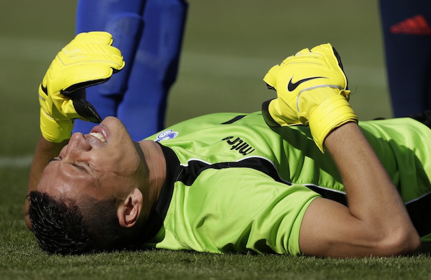 El Salvador goalkeeper Henry Hernandez winces in pain after a collision during the second half of their friendly match against Spain in Landover, Maryland June 7, 2014. u00e2u20acu201d Reuters pic