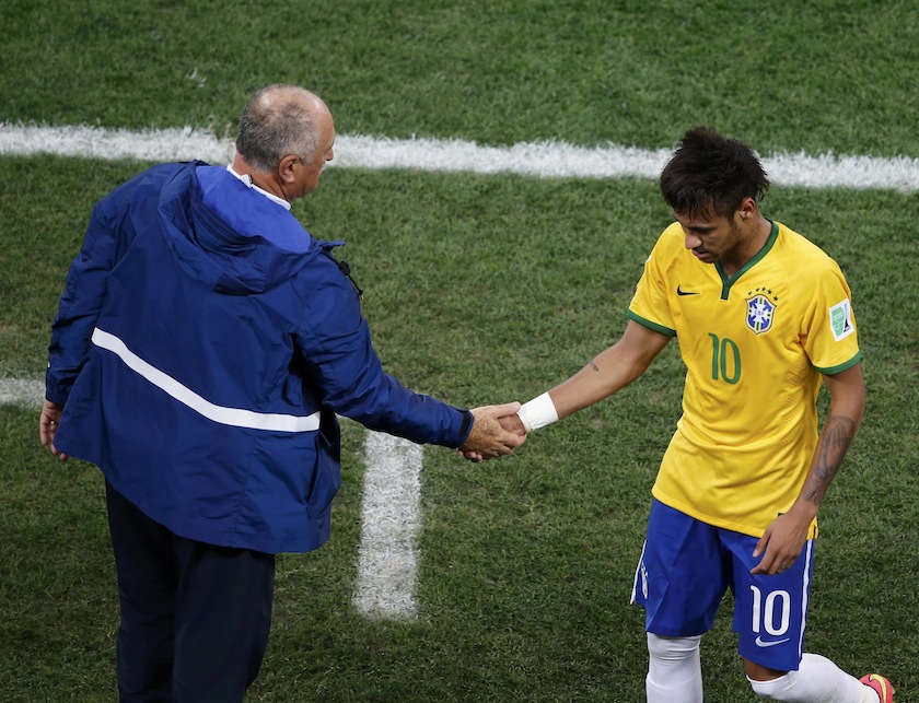Brazil's coach Luiz Felipe Scolari shakes the hand of player Neymar as the latter leaves the pitch during the 2014 World Cup opening match against Croatia at the Corinthians arena in Sao Paulo June 12, 2014. u00e2u20acu201du00c2u00a0Reuters pic