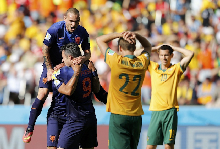 Robin van Persie (second from left) of the Netherlands celebrates with teammates after scoring a goal, as Australia's Alex Wilkinson and Australia's Ryan McGowan react, during their 2014 World Cup Group B match in Porto Alegre June 19, 2014. u00e2u20acu201d Reuters p