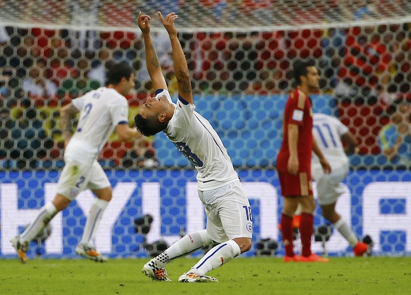 Chile's Gonzalo Jara celebrates a goal by his teammate Chile's Charles Aranguiz (not pictured) during their 2014 World Cup Group B match against Spain at the Maracana stadium in Rio de Janeiro June 19, 2014.u00c2u00a0u00e2u20acu201du00c2u00a0Reuters pic