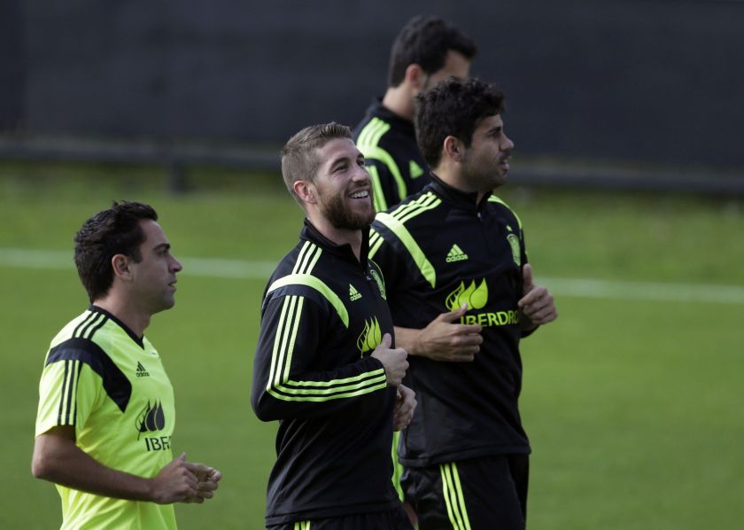 Spain's national team defender Sergio Ramos (second from left) runs with teammates during a training session in Curitiba, June 14, 2014. u00e2u20acu2022 Reuters pic  