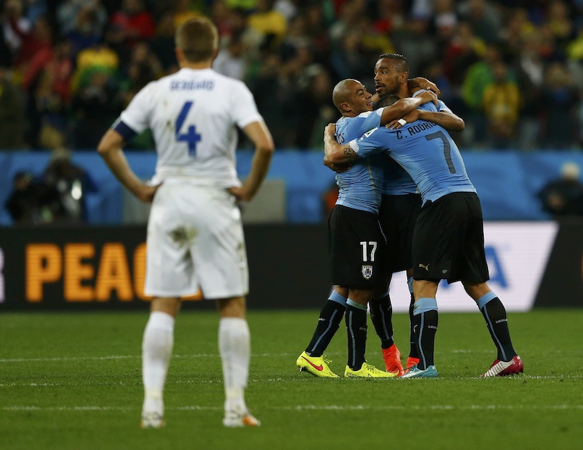England's Steven Gerrard watch Uruguay players celebrate a goal by Uruguay's Luis Suarez during their 2014 World Cup Group D match at the Corinthians arena in Sao Paulo June 20, 2014.u00c2u00a0u00e2u20acu201d Reuters pic
