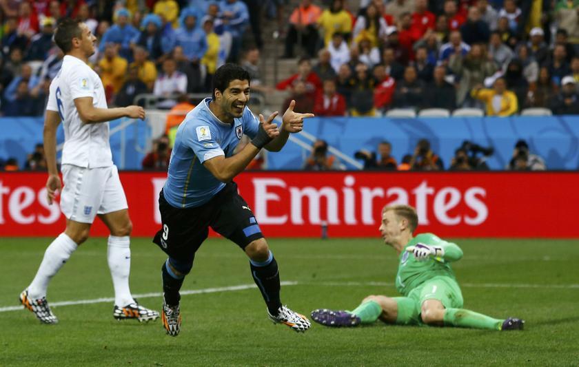 Uruguay's Luis Suarez (centre) celebrates after scoring his team's first goal past England's goalkeeper Joe Hart (right) during their 2014 World Cup Group D match at the Corinthians arena in Sao Paulo June 20, 2014.u00c2u00a0u00e2u20acu201d Reuters pic