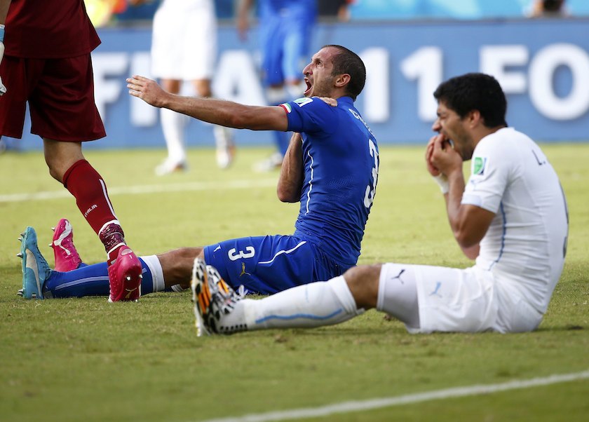 Uruguayu00e2u20acu2122s Luis Suarez reacts after clashing with Italyu00e2u20acu2122s Giorgio Chiellini during their 2014 World Cup Group D match at the Dunas arena in Natal June 24, 2014. u00e2u20acu201d Reuters pic