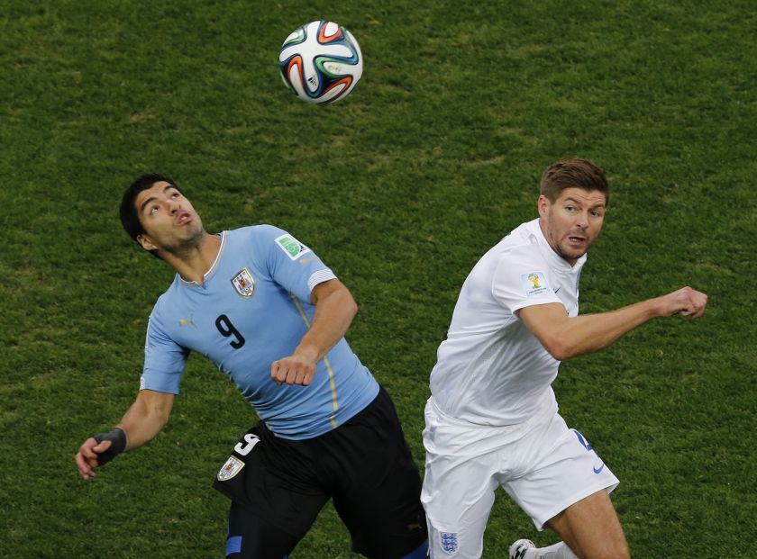 Uruguay's Luis Suarez (left) and England's Steven Gerrard fight for the ball during their 2014 World Cup Group D football match at the Corinthians arena in Sao Paulo June 20, 2014. u00e2u20acu201d Reuters pic