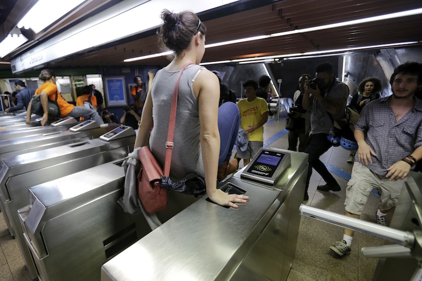 Demonstrators jump over the turnstiles without paying subway fare in support of a strike by metro workers in Sao Paulo June 9, 2014. u00e2u20acu201du00c2u00a0Reuters pic