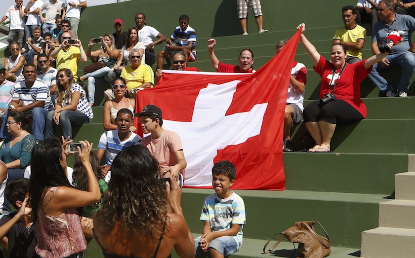 Fans of Switzerland's national team display a Swiss national flag during a training session at the stadium in Porto Seguro June 16, 2014.u00c2u00a0u00e2u20acu201d Reuters pic