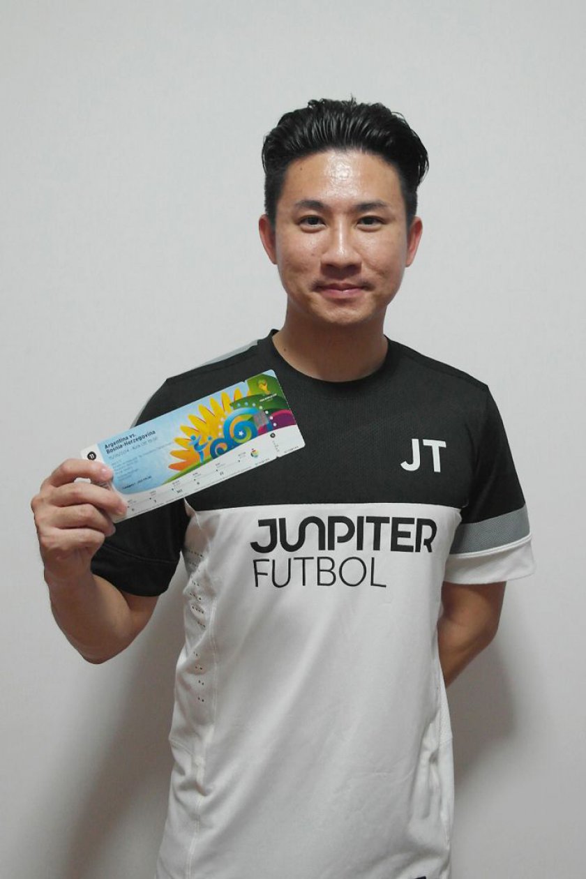Jun Tan with his ticket for the Argentina vs Bosnia-Herzegovina match in Rio de Janeiro. — TODAY pic