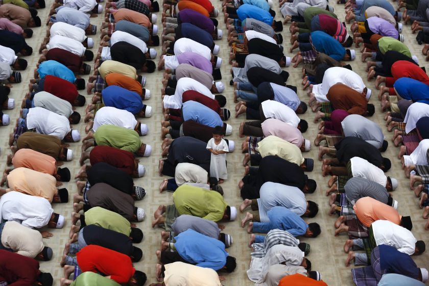 A boy stands amongst Malaysian Muslims performing a special prayer called u00e2u20acu02dctaraweehu00e2u20acu2122 in Tuanku Mizan Zainal Abidin mosque ahead of the holy month of Ramadan in Putrajaya, outside Kuala Lumpur June 29, 2014.  u00e2u20acu2022 Reuters pic