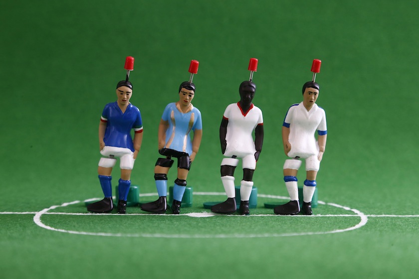 Figures for the table game 'Tipp Kick' are pictured at the manufacturing site of Edwin Mieg Ohg in Villingen-Schwenningen, near Freiburg, June 12, 2014. (From left) Figures depicting players from Group D; Italy, Uruguay, Costa Rica and England. u00e2u20acu201d Reuter