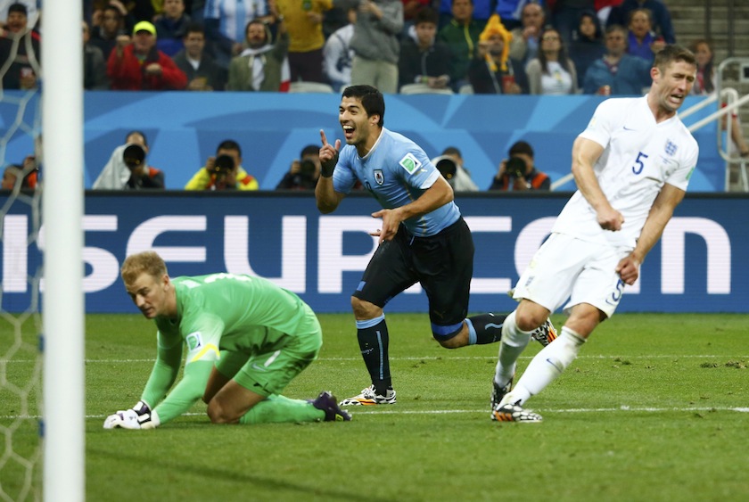 England's Gary Cahill (right) and Joe Hart (left) react as Uruguay's Luis Suarez celebrates his goal during their 2014 World Cup Group D match at the Corinthians arena in Sao Paulo June 20, 2014.u00c2u00a0u00e2u20acu201du00c2u00a0Reuters pic