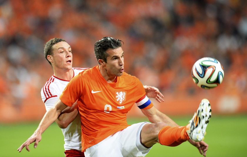 Robin van Persie (right) of the Netherlands fights for the ball with James Chester of Wales during their international friendly soccer match in Amsterdam June 4, 2014. u00e2u20acu201d Reuters pic
