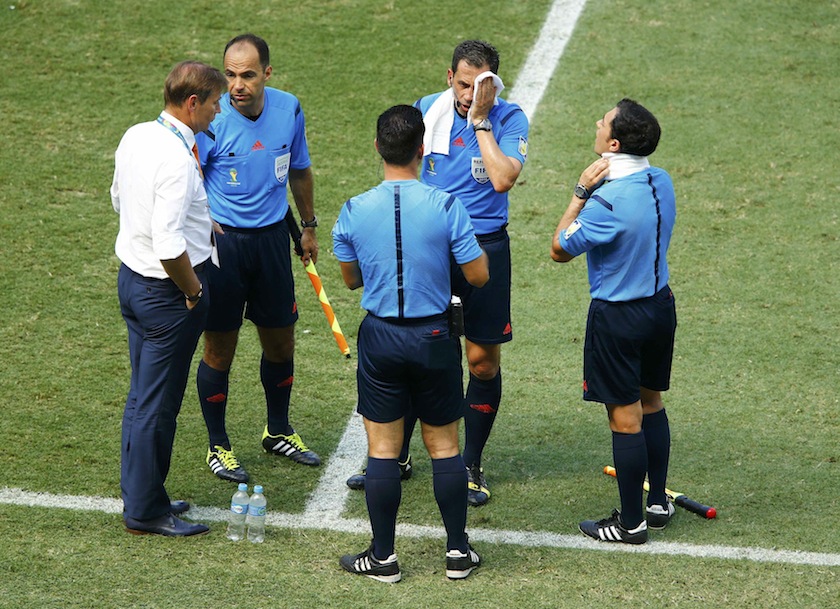 Officials take a water break during the 2014 World Cup round of 16 game between Mexico and the Netherlands at the Castelao arena in Fortaleza June 30, 2014.u00c2u00a0u00e2u20acu201d Reuters pic