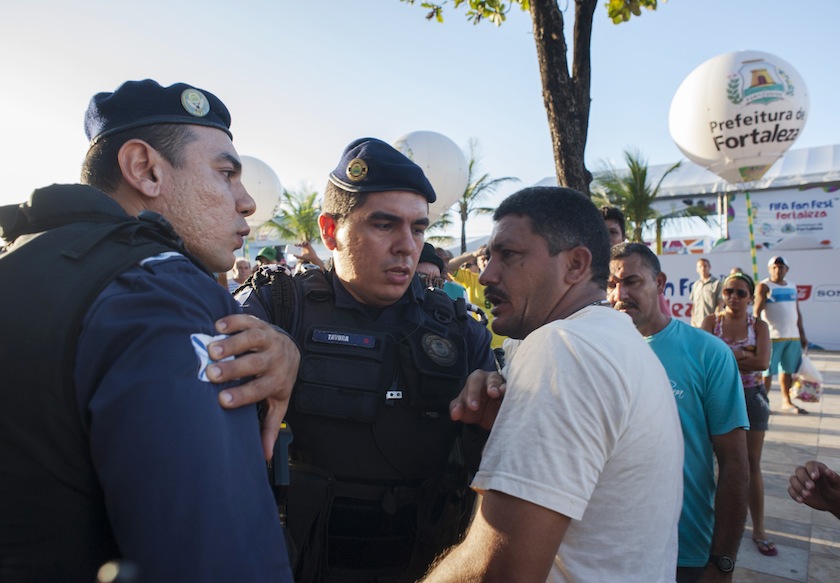 Police argue with a street vendor as they expel them from the area around the FIFA Fan Fest during the inauguration in Fortaleza, June 8, 2014. u00e2u20acu201du00c2u00a0Reuters pic