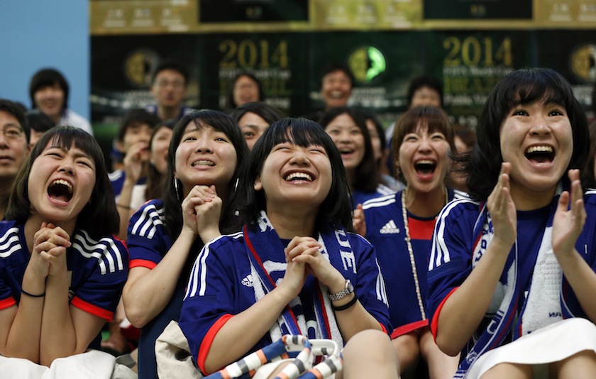 Fans of Japan's national team celebrate after Japan's Keisuke Honda scored against Ivory Coast as they watch their team play in the 2014 World Cup at a public viewing event in Tokyo June 15, 2014. u00e2u20acu201d Reuters pic