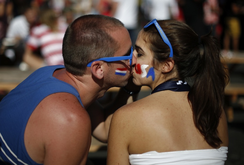 Fans Jeremy McKnight and Sara Stringfellow kiss after the 2014 World Cup Group G match between Portugal and the US at a viewing party in Los Angeles, California June 23, 2014.u00c2u00a0u00e2u20acu201d Reuters pic