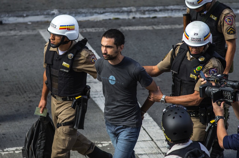 Police detain a protester who was participating in a demonstration against the 2014 World Cup in Belo Horizonte, as Colombia and Greece played a first round match in the same city, June 14, 2014.  u00e2u20acu201du00c2u00a0Reuters pic