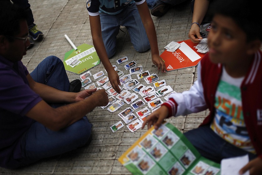 Children exchange stickers from the official 2014 FIFA World Cup sticker album at the Azteca Stadium in Mexico City June 7, 2014. u00e2u20acu201du00c2u00a0Reuters pic