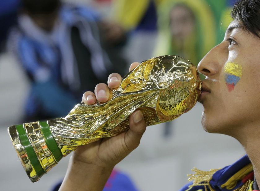 An Ecuador fan kisses a trophy before the 2014 World Cup Group E football match between Honduras and Ecuador at the Baixada arena in Curitiba June 21, 2014. u00e2u20acu201d Reuters pic