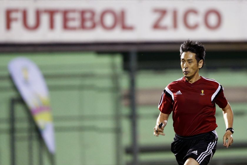 Referee Yuichi Nishimura of Japan runs during the last referee training camp before the 2014 World Cup at the Zico Football Centre in Rio de Janeiro June 6, 2014. u00e2u20acu201d Reuters pic