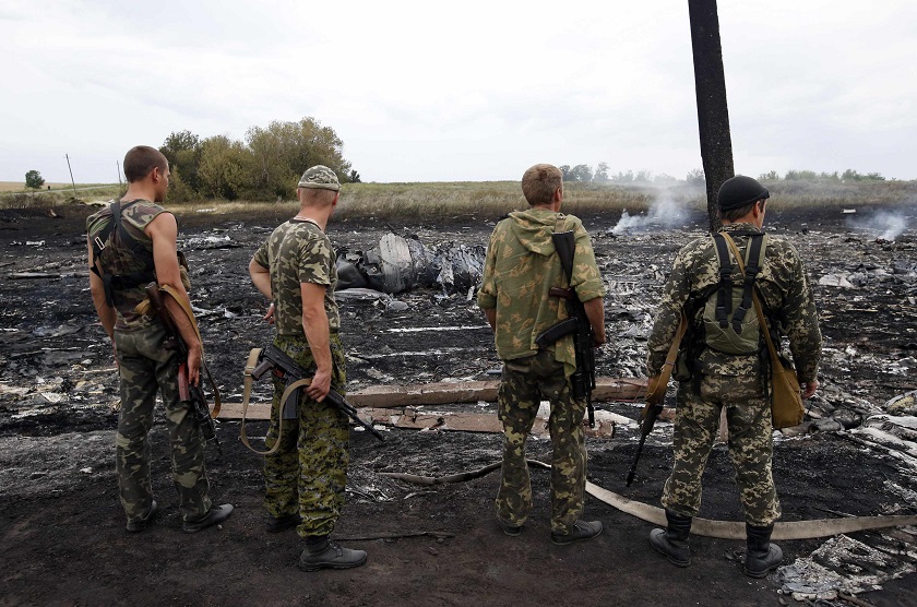 Armed pro-Russian separatists stand at the site of a Malaysia Airlines Boeing 777 plane crash near the settlement of Grabovo in the Donetsk region, July 17, 2014. u00e2u20acu201d Reuters pic