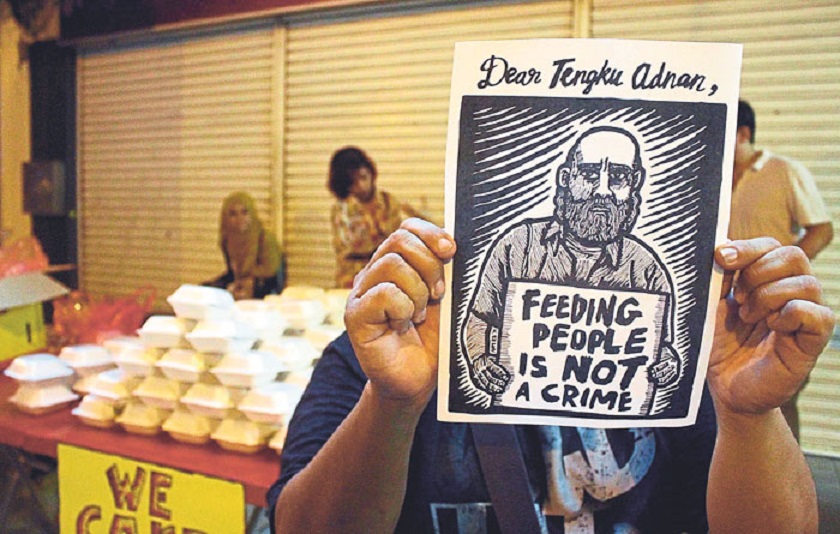 Soup kitchen defies Federal Territories Ministeru00e2u20acu2122s ruling to stop food giveaways in Kuala Lumpur. u00e2u20acu201d Picture by Nizlal Ghazali