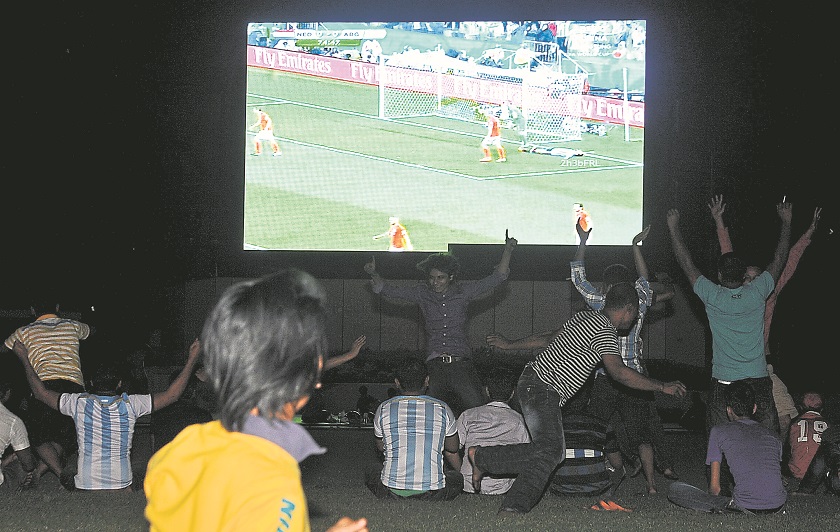 Spectators watch the World Cup game between Argentina and Holland at Dataran Merdeka on Thursday morning. u00e2u20acu201d Picture by Ahmad Zamzahuri