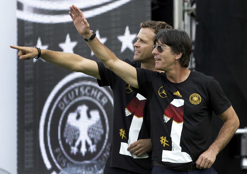 Germanyu00e2u20acu02dcs head coach Joachim Loew and team manager Oliver Bierhoff (left) applaud fans during celebrations to mark the teamu00e2u20acu2122s 2014 Brazil World Cup victory, at a u00e2u20acu02dcfan mileu00e2u20acu2122 public viewing zone in Berlin July 15, 2014. u00e2u20acu201d Reuters pic