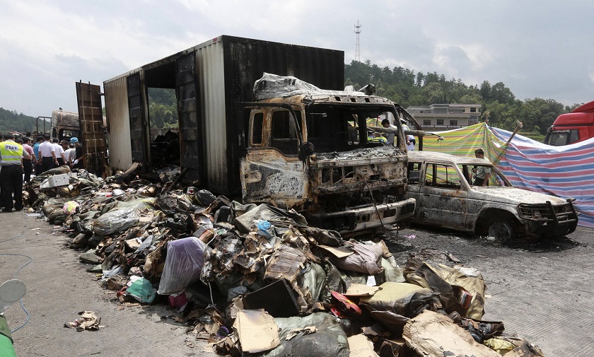 Debris is seen next to burnt vehicles after an explosion and a fire following a traffic accident, at a section of the Hukun (Shanghai to Kunming) highway in Shaoyang, Hunan province July 19, 2014. u00e2u20acu201d Reuters pic