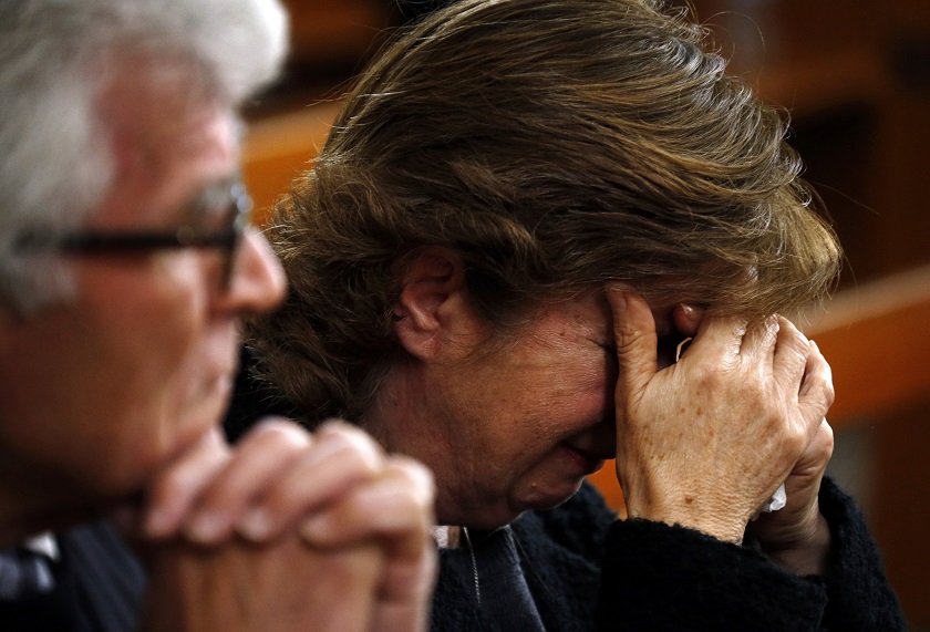A member of the Australian Ukrainian community cries during a prayer vigil for those killed in the Malaysia Airlines passenger jetliner MH17 crash, at the St Andrewu00e2u20acu2122s Ukrainian Catholic church in Sydney July 19, 2014. u00e2u20acu201d Reuters pic