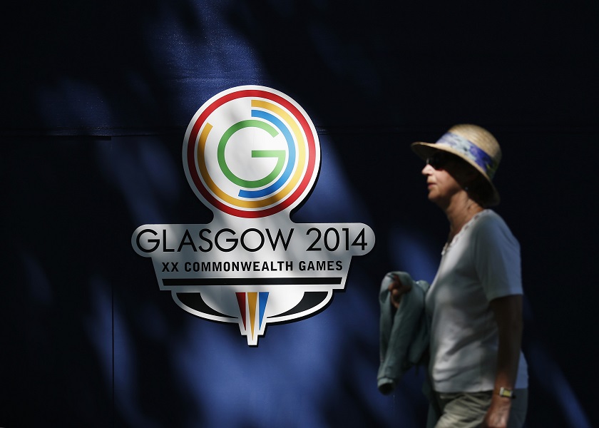 A spectator walks past the Commonwealth Games logo at the Kelvingrove Lawn Bowls Centre in Glasgow, Scotland, July 24, 2014. u00e2u20acu201d Reuters pic
