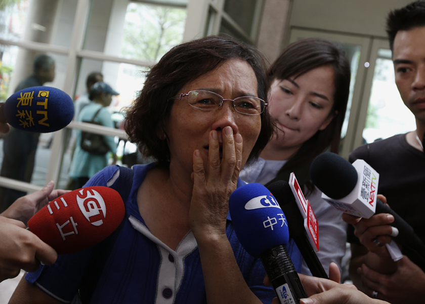 Hu Hong-jiao, 60, cries as she recalls news of a TransAsia Airways plane crash in which her 34-year-old daughter Hu Yu-jie was traveling, July 24, 2014. u00e2u20acu201d Reuters pic