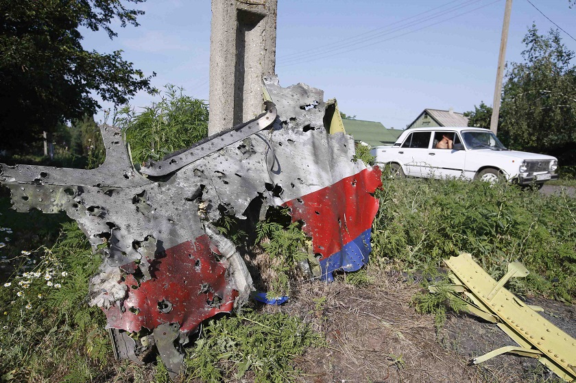 A piece of the wreckage is seen at a crash site of the Malaysia Airlines Flight MH17 in the village of Petropavlivka (Petropavlovka), Donetsk region, July 25, 2014. u00e2u20acu201d Reuters picnn