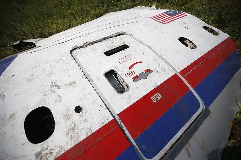 A piece of the wreckage is seen at a crash site of the Malaysia Airlines Flight MH17 near the village of Petropavlivka (Petropavlovka), Donetsk, region July 25, 2014. u00e2u20acu201d Reuters pic