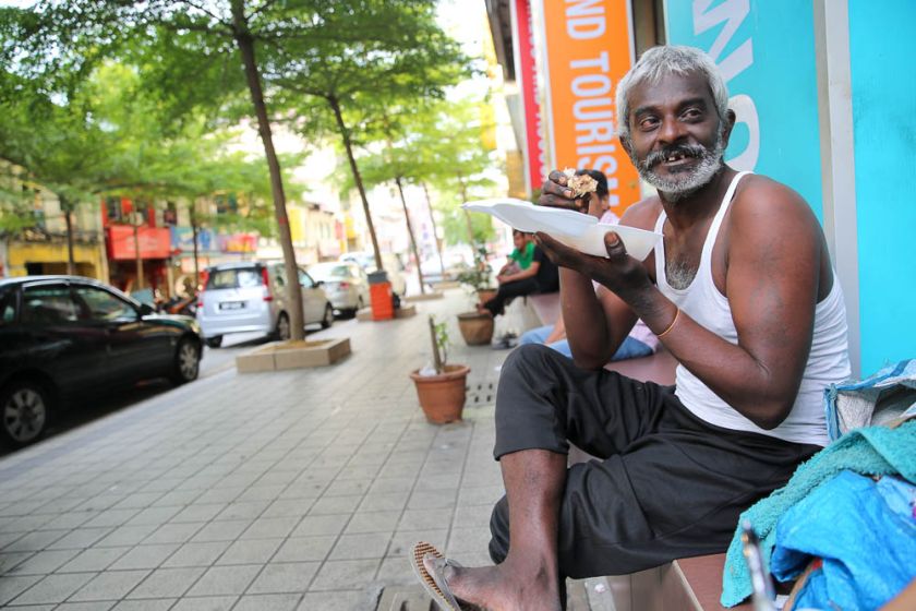 Arinburagan sleeps in a field in Dataran Merdeka in the morning because he works as a car park attendant at night, and itu00e2u20acu2122s too expensive to travel back to the shelter at a Hindu temple in Puchong. u00e2u20acu2022 Picture by Choo Choy May