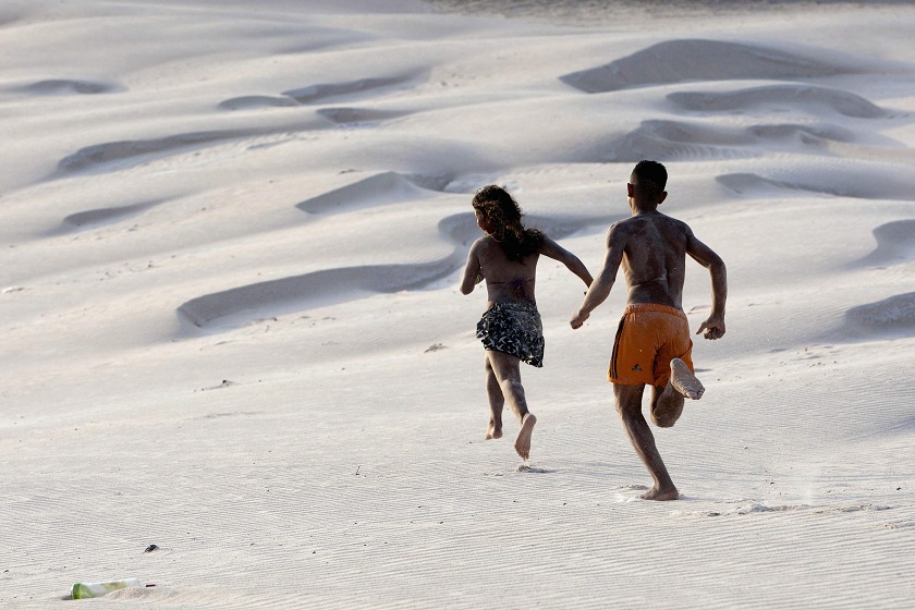 Tourists enjoy the water during the summer vacation season on Atalaia beach in Salinopolis, Para state, July 30, 2014. Salinopolis, with a population of 40,000, receives nearly 280,000 visitors in July, mostly to enjoy the beaches located just southeast o
