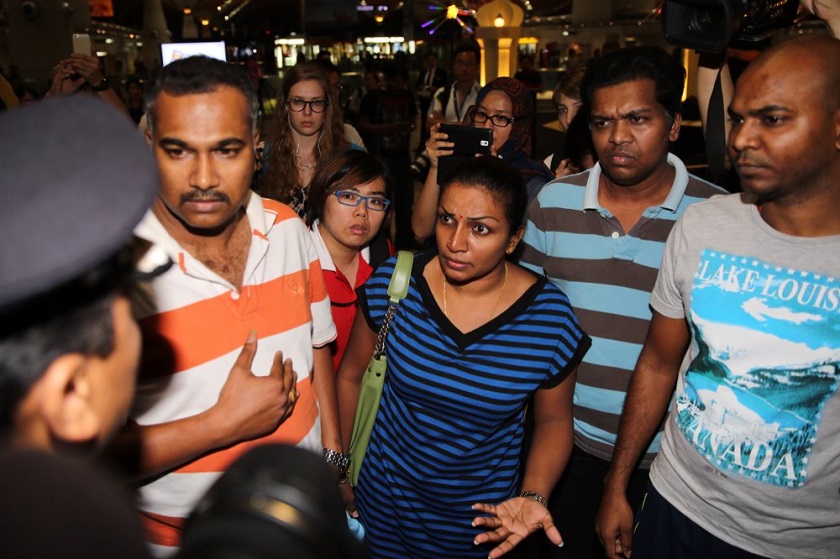 Family members enquire about the flight name list following the tragic news of Malaysia Airlines Flight MH1 at the Kuala Lumpur International Airport, July 18, 2014. u00e2u20acu201d Picture by Choo Choi May