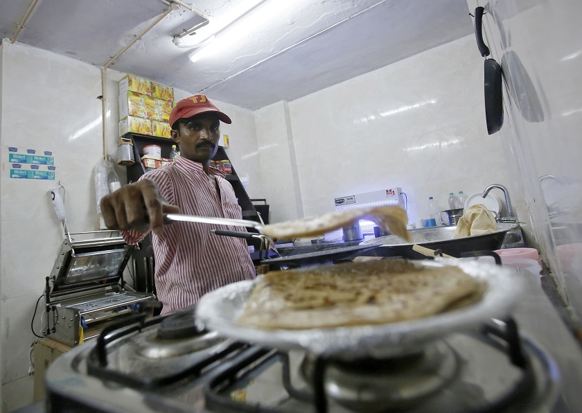 An inmate prepares food inside the kitchen of a restaurant run by the Tihar Jail authorities on Jail Road in west Delhi July 21, 2014. u00e2u20acu2022 Reuters pic