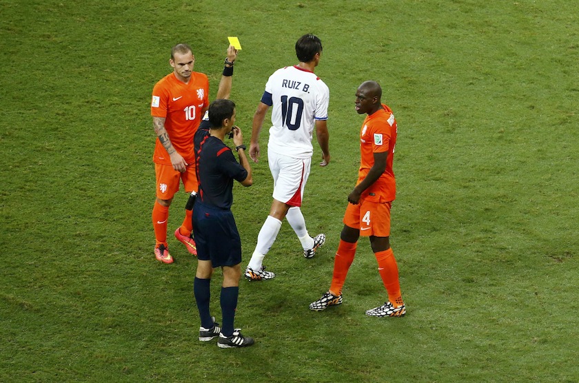 Referee Ravshan Irmatov of Uzbekistan shows the yellow card to Bruno Martins Indi of the Netherlands for a foul on Costa Rica's Bryan Ruiz during their 2014 World Cup quarter-finals at the Fonte Nova arena in Salvador July 6, 2014.u00c2u00a0u00e2u20acu201d Reuters pic