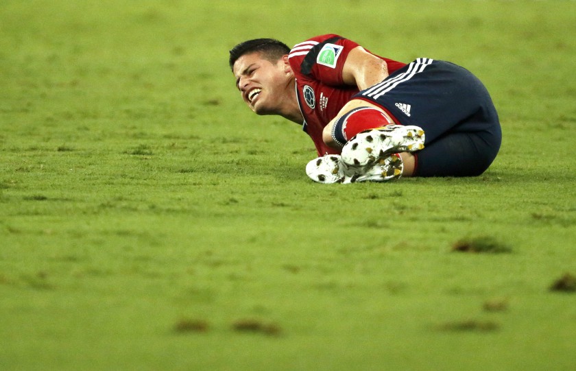 Colombiau00e2u20acu2122s James Rodriguez lies on the pitch in pain after being fouled during the 2014 World Cup quarter-finals between Brazil and Colombia in Fortaleza July 4, 2014. u00e2u20acu201d- Reuters pic